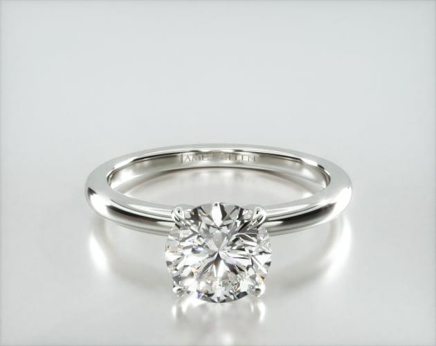 Solitaire Engagement Ring Embellished With a Four Prong Signature Head