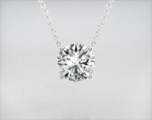 This light four prong wire basket is designed to showcase the unique beauty of a round brilliant diamond of your choice. This lovely solitaire pendant is attached to an 16-18 adjustable cable link chain. Truly a classic design that is perfect for any occasion. Center diamond or gemstone purchase required