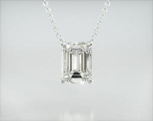 This light four prong wire basket is designed to showcase the unique characteristics of the emerald cut diamond of your choice. This lovely solitaire pendant is attached to an 18" cable link chain. Truly a classic design that is perfect for any occasion. Center diamond or gemstone purchase required