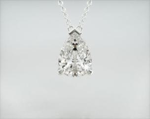 This light wire basket is designed to showcase the unique characteristics of the pear shaped diamond of your choice. This lovely solitaire pendant displays the pear shape point up and is attached to an 18" cable link chain. Truly a classic design that is perfect for any occasion.