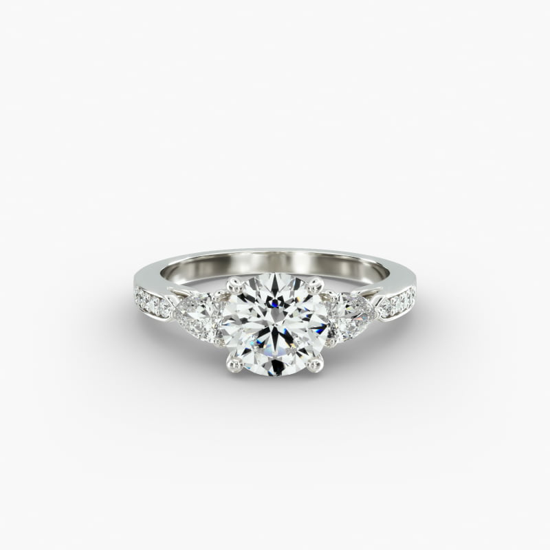 Pear Shaped Diamond Three Stone Engagement Ring With Pavé Set Diamonds In 14K White Gold