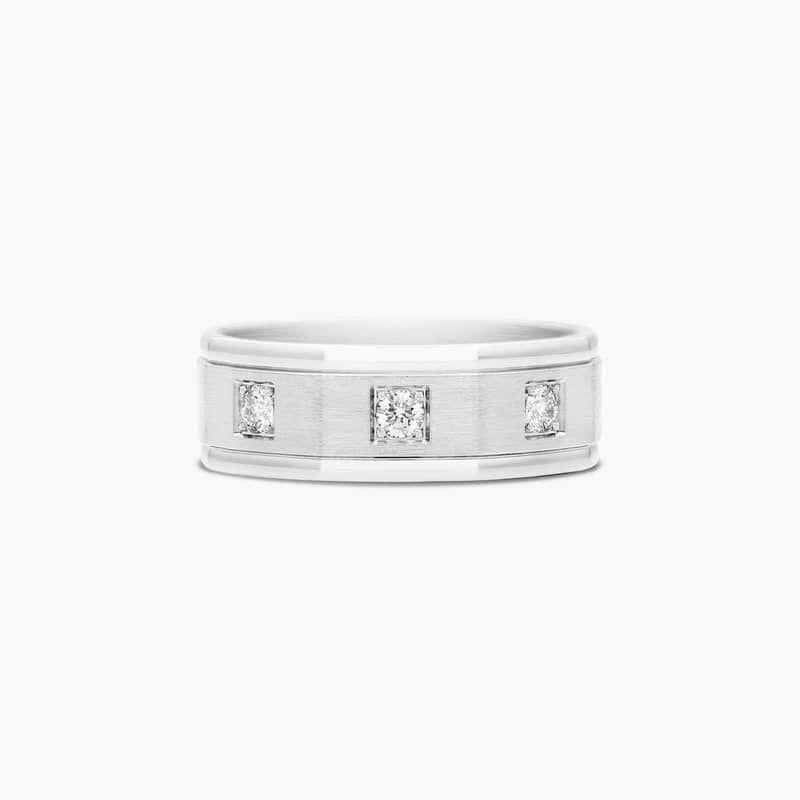 This elegant and stylish 8mm octagonal comfort-fit features three round brilliant diamonds set in a satin finished center with high polished edges. (A comfort fit design features a rounded polished interior that allows the ring to slide easily and rest comfortably on the finger. )