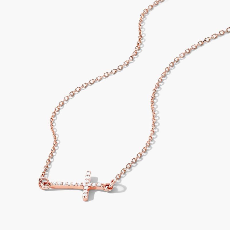 Rose gold store cross necklace sideways