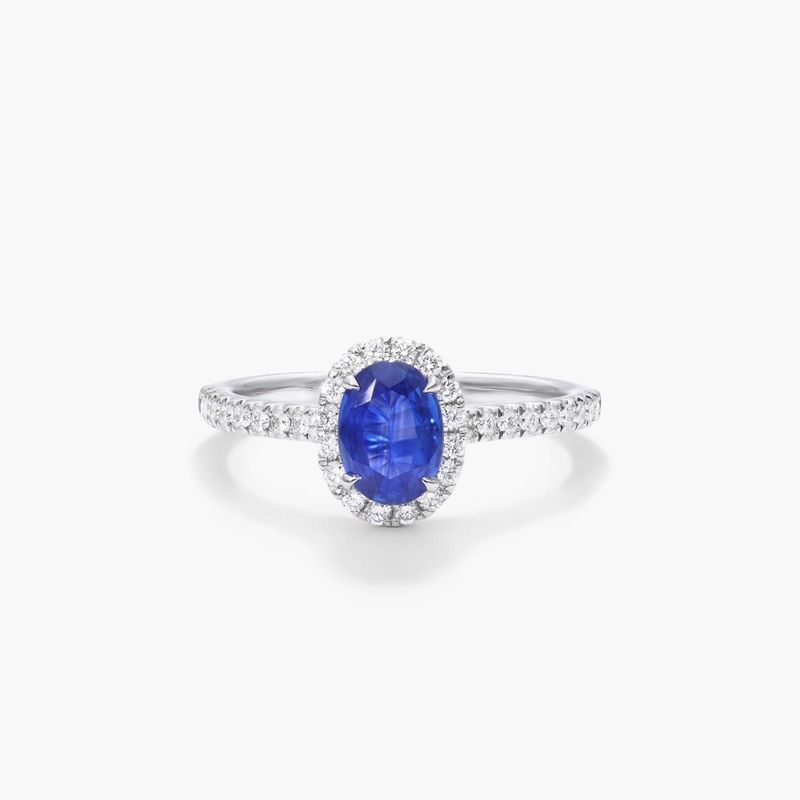 Oval Halo Sapphire And Diamond Ring In 18K White Gold