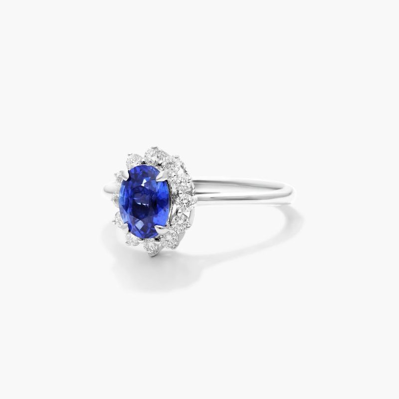 Oval Halo Sapphire And Diamond Ring In 18K White Gold