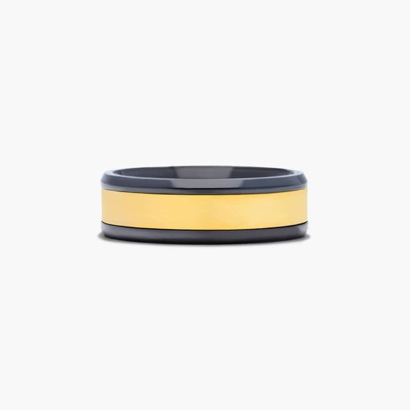This 7mm ring features a 14k yellow gold center inlay and a black titanium contrasting edges.