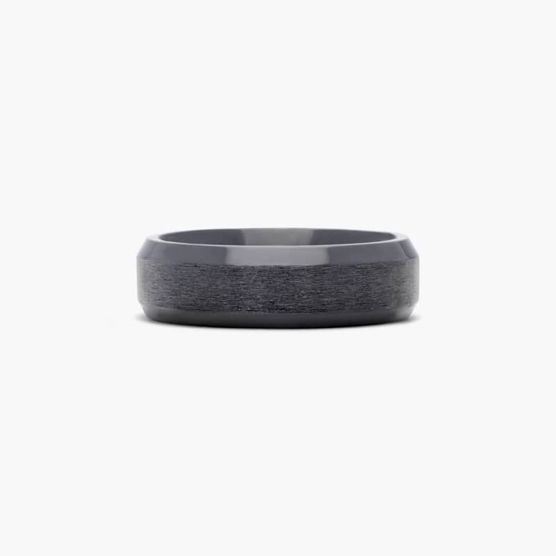 This satin finished 7mm black titanium band features a beveled edge and exemplifies a sleek and industrial style.