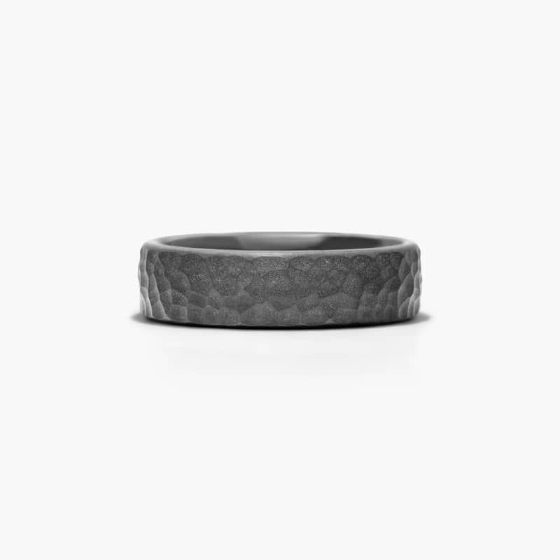 Titanium has the great quality of being lightweight yet incredibly strong. This black titanium ring features a hammered finish and a comfort fit design.