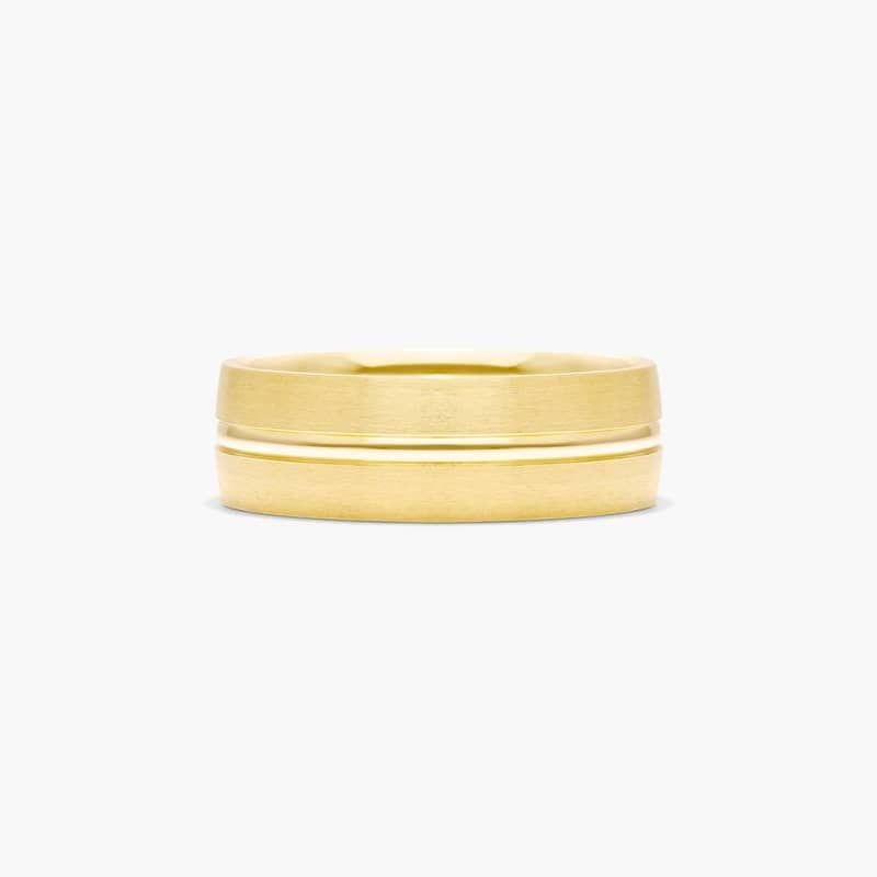 This modern ring features a satin finish that elegantly reflects light. It is complemented by a high polished groove in the center to achieve a sleek look.