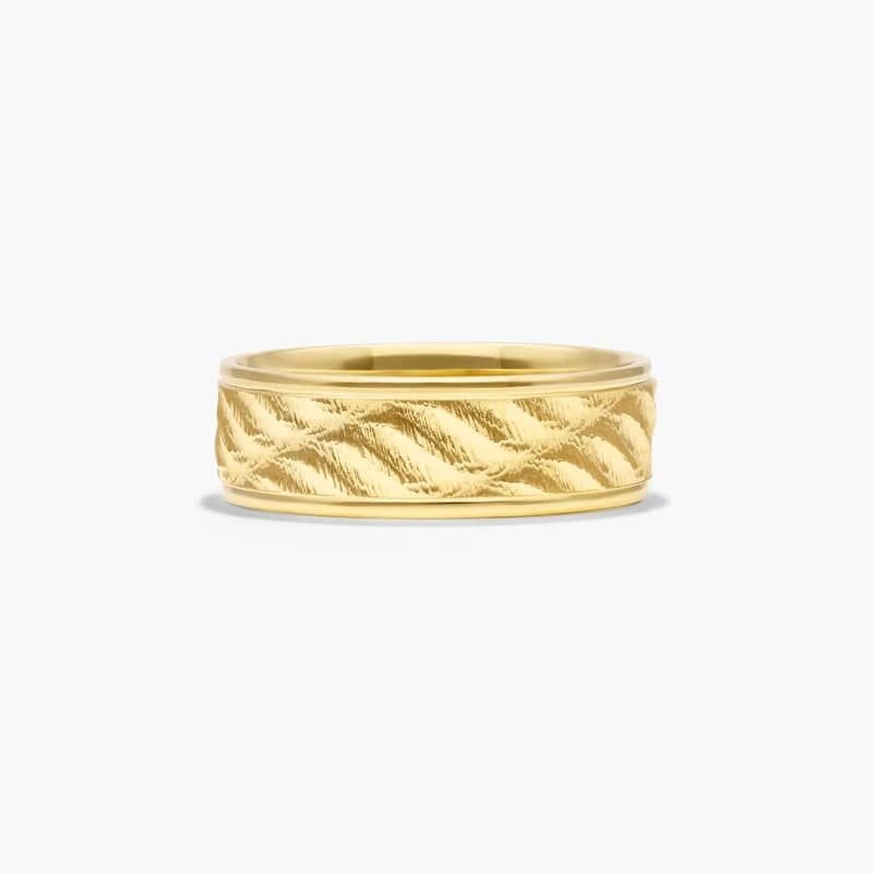 If you are looking for something unique look no further. This design features a very finely carved wave pattern that reflect light so it gives the optical illusion of movement. A mesmerizing ring that will capture you every time.