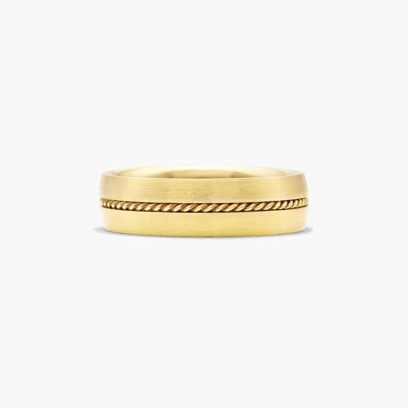 A smooth satin finished band with a twisted cable insert in the center makes this band minimalistic and modern.