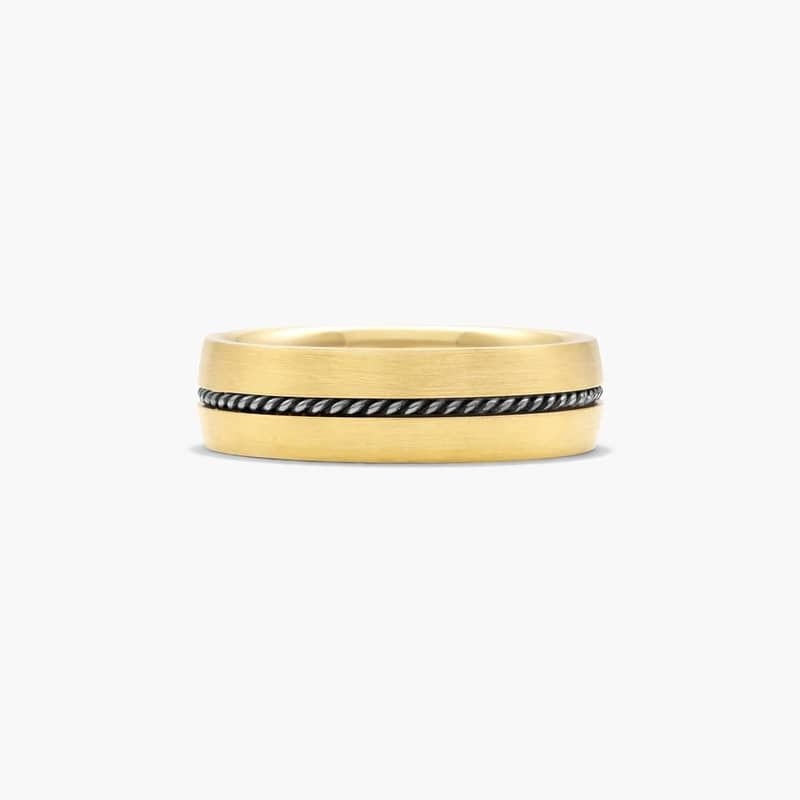 A smooth satin finished yellow gold band with a white gold twisted cable insert in the center makes this band minimalistic and modern.