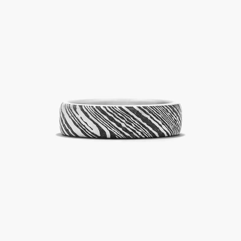 The durability of tantalum is enhanced by a woodgrain pattern to create a ring symbolizing both strength and style.