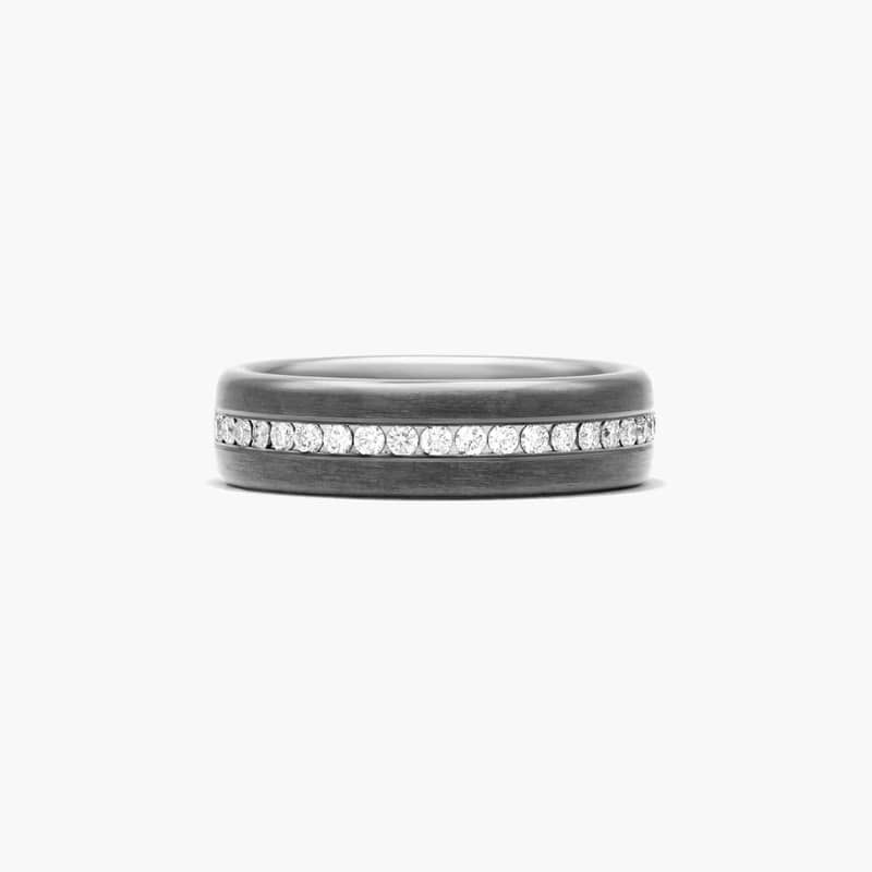 Dazzling diamonds adorn black titanium to result in a ring that radiates strength and style.