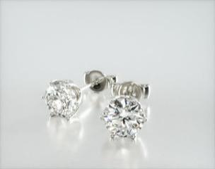 This design is nothing short of stunning, made to accent the beauty of the round brilliant diamond by using 6 prongs and a scalloped basket. This earring will fit snugly against the ear and allow maximum brilliance of the diamond of your choice. Center diamonds or gemstones purchase required