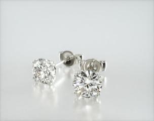 This design is sleek and sophisticated, made to accent the beauty of the round brilliant diamond of your choice by using split prongs and a tapered wire basket. This earring fit slightly off the ear and features friction backs. Available in screw backs for an additional $125. Center diamonds or gemstones purchase required