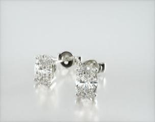 This pair of classic earrings feature a tapered basket that showcases the unique characteristics of the oval shape diamonds of your choice. Splinters of light shimmer and shine with every move. Center diamonds or gemstones purchase required