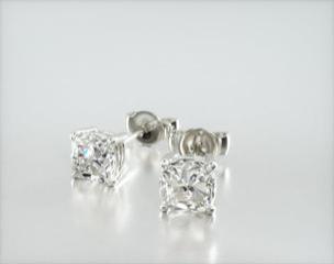 This pair of classic cushion shape diamond earrings feature a tapered basket, showcasing the unique characteristics of the cushion shape diamonds of your choice. Bold chunks of light shimmer and shine with every move. Center diamonds or gemstones purchase required