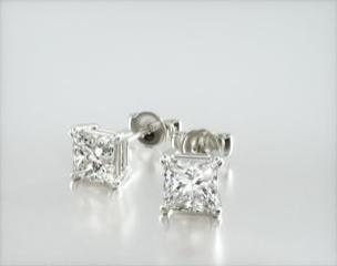 This pair of classic princess cut diamond earrings feature a tapered basket, showcasing the unique characteristics of the princess cut diamonds of your choice. Linear, chunky flashes of light shimmer though out this dramatic geometric pattern. Center diamonds or gemstones purchase required
