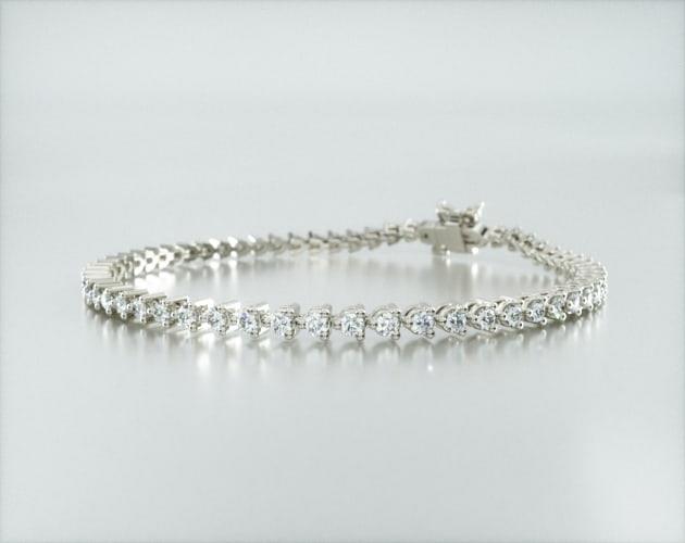 bracelets, tennis bracelets, 14k white gold three prong flower clasp
