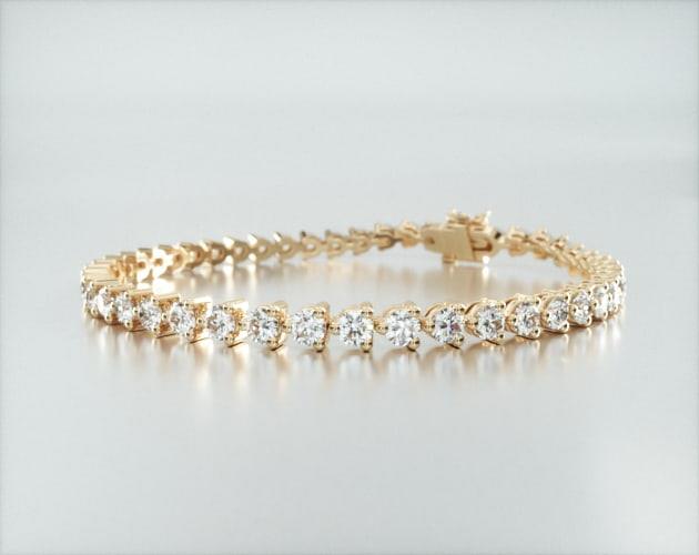 bracelets, tennis bracelets, 14k yellow gold three prong flower clasp