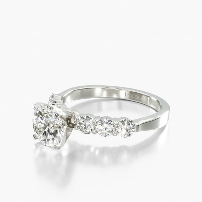 This classic ring style features round shaped diamonds set in common prongs to emphasize the allure of the center diamond or gemstone of your choice. It is an impressive ring with plenty of fire and sparkle.
