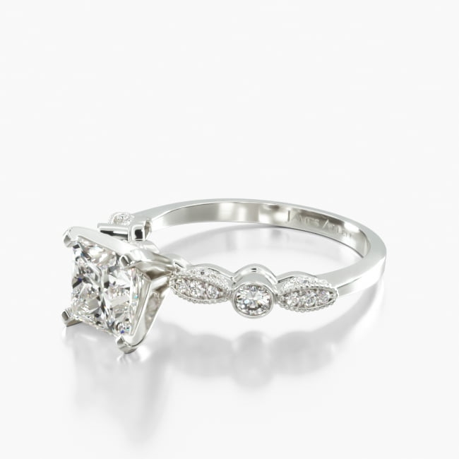 This vintage-inspired ring showcases multiple round shaped diamonds in a stunning display of both bezel and Pavé settings. This elegant design will accentuate the center diamond or gemstone of your choice.