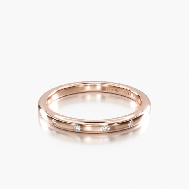 This stunning high polished rounded, classic ring features diamonds that are placed and spaced elegantly to achieve a simple and sleek look.