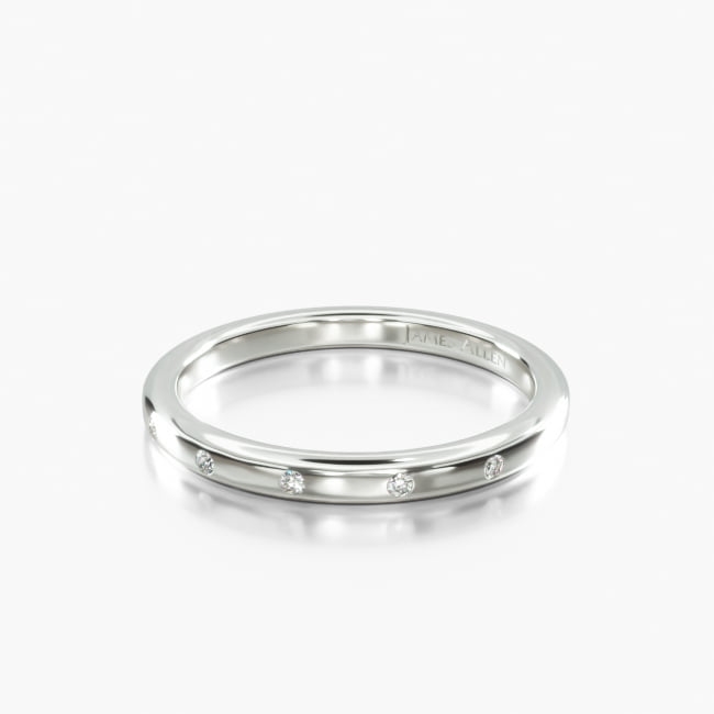 This stunning high polished rounded, classic ring features diamonds that are placed and spaced elegantly to achieve a simple and sleek look.