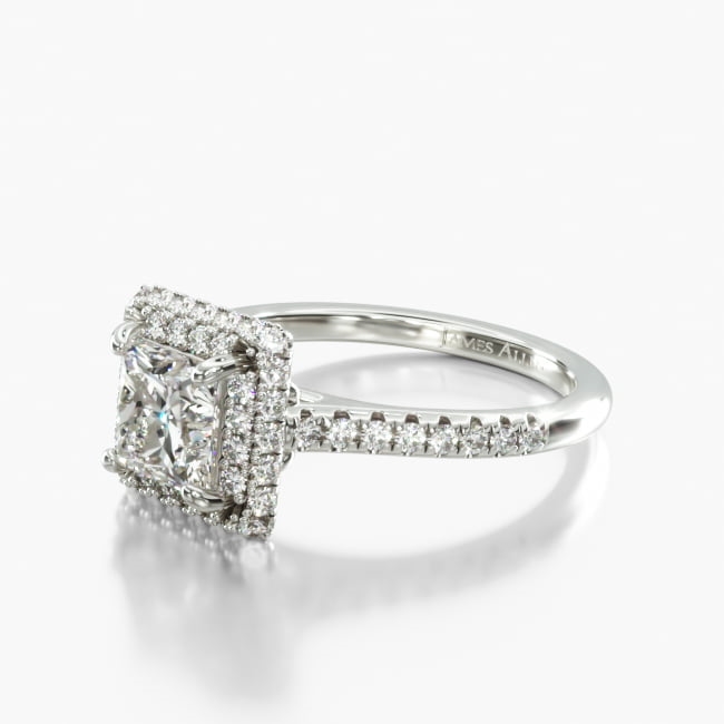 The Pavé falls over the edge of this smashing diamond halo ring, creating an impressive display of fireworks and light play. Set with the center diamond or gemstone of your choice, it is sure to be a sensation. 
Please allow additional time for fancy shape diamonds and gemstones.