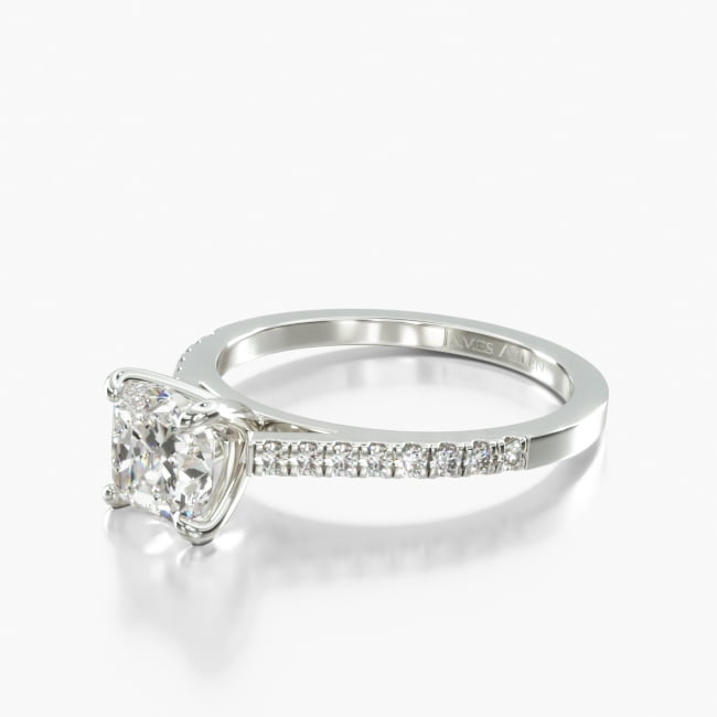 This pavé accented, classic cathedral engagement ring with a simple prong head assembly is the perfect way to express your love. 
This setting is able to hold all shapes, but please allow additional manufacturing time for fancy shapes.