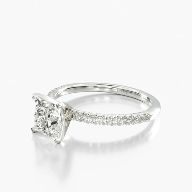 This French Cut Pavé diamond engagement ring is created to maximize the amount of light that hits the diamonds from all sides, set with a small v shape under the diamond, increasing their individual sparkle.