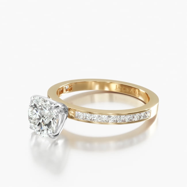 This narrow delicate version of the classic channel-set engagement ring features 20 channel-set princess shaped diamonds mounted into the shank around the center diamond or gemstone of your choice. An open prong setting allows you to see the majority of the center diamond.