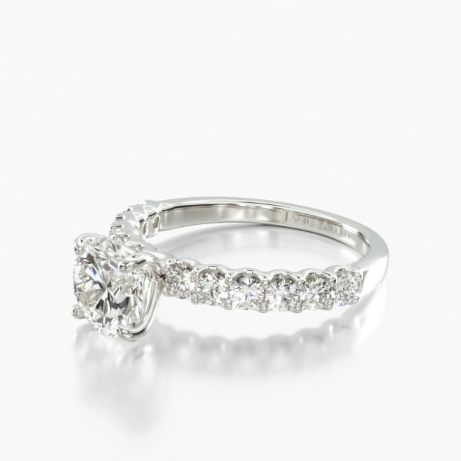 A dreamy ring featuring twelve side diamonds takes shine to the next level when worn with its matching wedding ring.