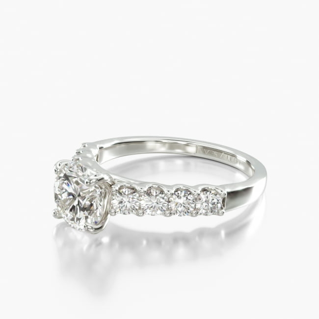 This fabulous ring features large side stones that lead up to the cathedral shank to hold up the center stone.