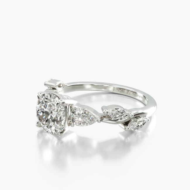 Inspired by nature this ring features marquise diamonds delicately dispersed on a sleek metal band with pear shape diamonds to perfectly accent the center diamond of your choice