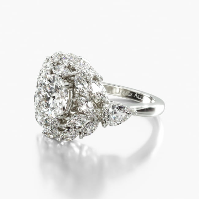 This spectacular ring features pear shape diamond accents with a beautiful double halo made of marquise diamonds that surround the center diamond of your choice.