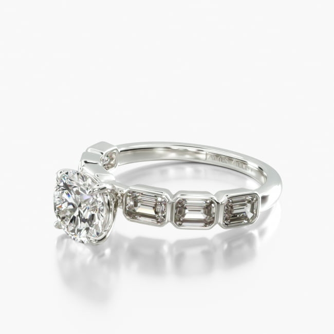 This simple yet unique ring features beautiful emerald cut diamonds set east west style within a secure bezel setting to perfectly compliment the center diamond of your choice