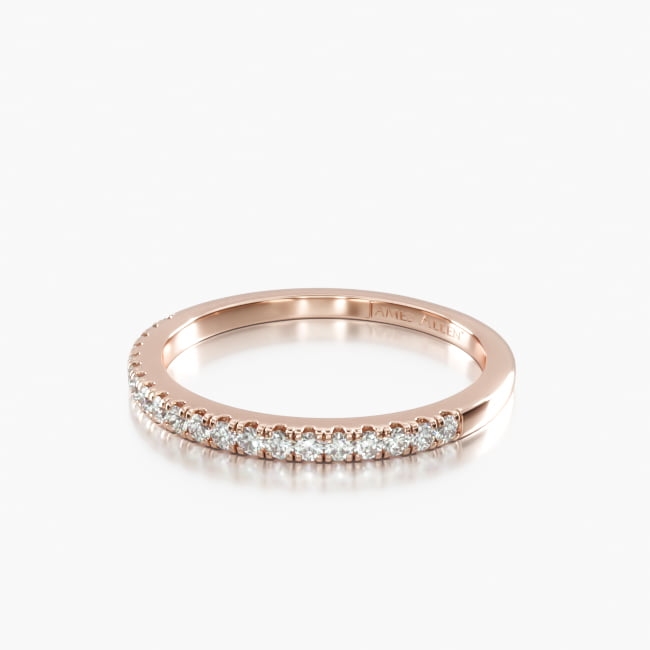 Delicate and sophisticated this single row diamond band is perfectly wearable alone or stacked with other rings for a glamorous and trendy look. Beautifully crafted with round brilliant cut diamonds set into a gold setting band.