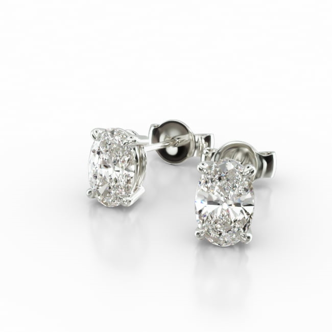 This pair of classic earrings feature a tapered basket that showcases the unique characteristics of the oval shape diamonds of your choice. Splinters of light shimmer and shine with every move. Center diamonds or gemstones purchase required