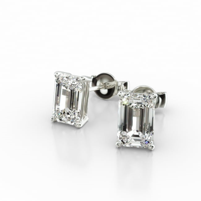 This pair of classic, emerald shape diamond earrings feature a tapered basket that showcases the unique characteristics of the emerald shape diamonds of your choice. The bold flashes of light and a luminescent nature capture the eye with every move. Center diamonds or gemstones purchase required