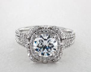 A bold, contemporary design for those looking to make a statement. The curves of this setting are evocative of a blossoming flower as it reaches towards the sun, its petals opening to reveal a stunning center diamond of your choice. Accent diamonds on the underside of the halo add visual interest to the ring when viewed from the side.