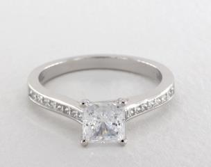 Jeff Cooper

Love is immortal. Channel set princess diamonds enliven the Emily Engagement Ring’s sleek, smart band, while your center diamond is cradled in the quintessential four prong setting. Together with its refined lines and proportions, elegant Emily needs no other accompaniment. Can be custom made to fit any shape center stone. Hand crafted in either Platinum, 18K Gold or 14K Gold.