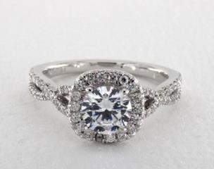 The infinity halo engagement ring represents everlasting love and devotion. This bold, modern diamond halo engagement ring features an infinity design twisted halo with brilliant diamonds accenting the center diamond of your choice.